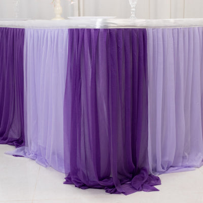 Purple and lavender table skirt draping elegantly over a table.