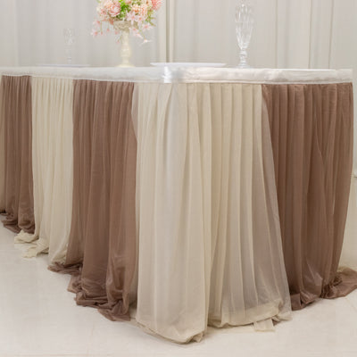 Elegant table skirt in cream and brown draping for events.