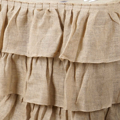 Close-up of textured burlap fabric with layered ruffles.