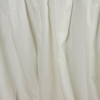 White satin fabric draped elegantly, showcasing smooth, flowing texture.