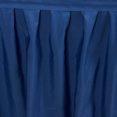 Navy blue pleated fabric texture close-up.