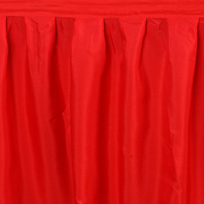 Red fabric draping with soft folds and texture.