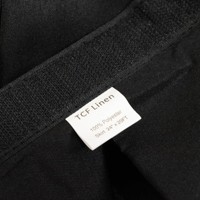 Black polyester skirt label showing brand TCF Linen, size 24"x 12FT.