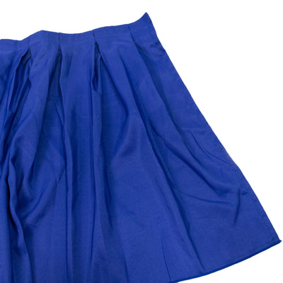 Pleated blue fabric drape on a white background
