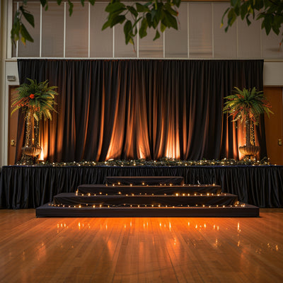 Elegant stage setup with draped fabric and ambient lighting.