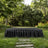 Elegant black draped table in lush green garden setting