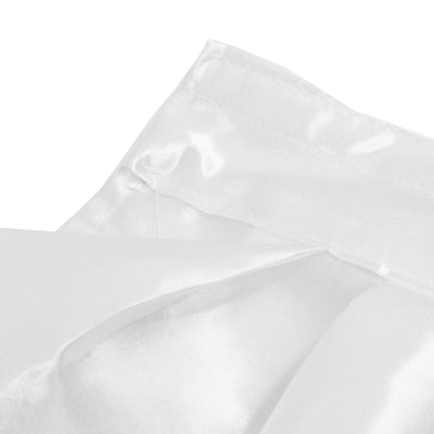 White quilted mattress protector close-up with textured fabric folds#whtbkgd