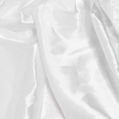 White wrinkled fabric texture background, soft abstract textile close-up