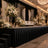 Elegant wedding stage with white floral arrangements, candles, and chandelier lighting