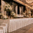 Elegant wedding stage with white floral arrangements and luxury ballroom decor
