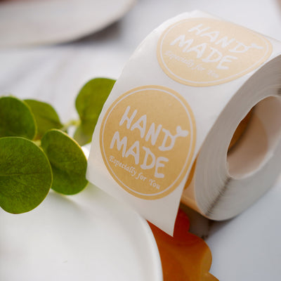 Handmade label roll on a white background