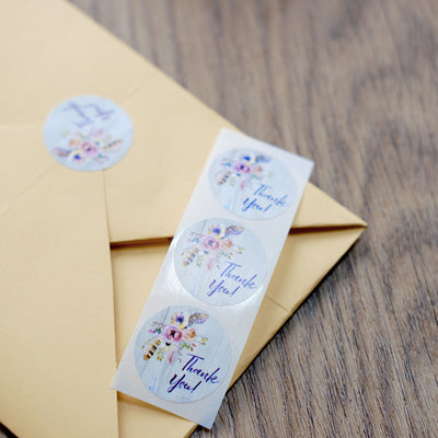 Floral "Thank You" stickers on an envelope