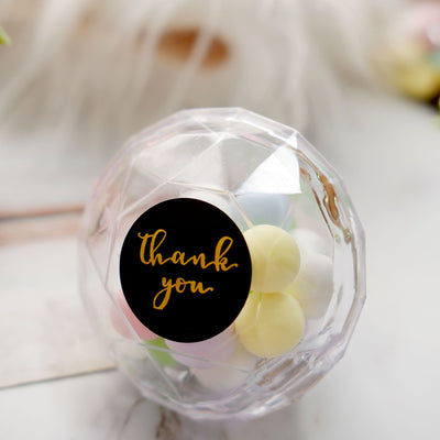 Clear thank you gift ball with colorful candies inside.