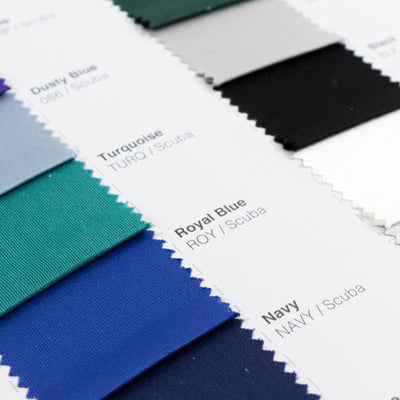 Swatches of fabric in various colors including Royal Blue, Navy, and Turquoise.