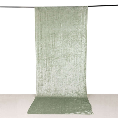Green velvet fabric backdrop for photography studio use.