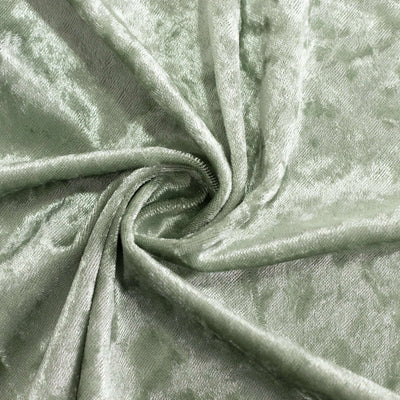 Soft green velvet fabric with a smooth texture.