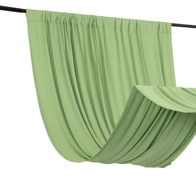 Green draped fabric hanging on a rod for home decor or photography use.