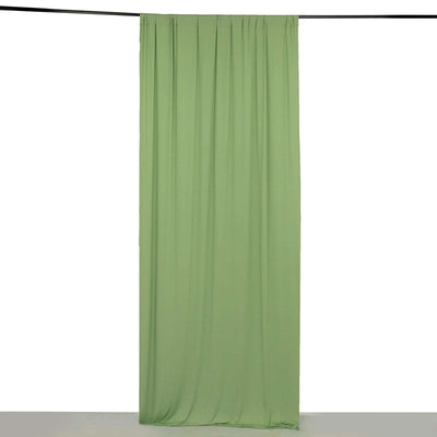 Green fabric curtain hanging against a white backdrop