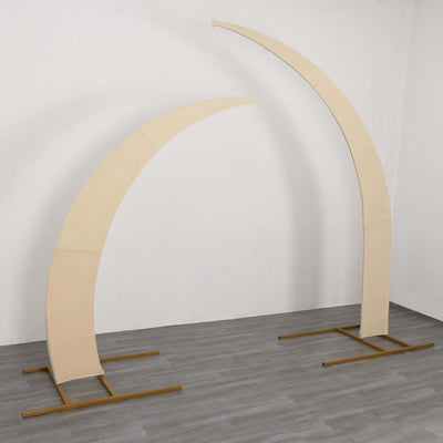 Curved fabric display stands on a plain backdrop
