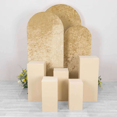 Golden arch and cream pedestal display setup for events or photography