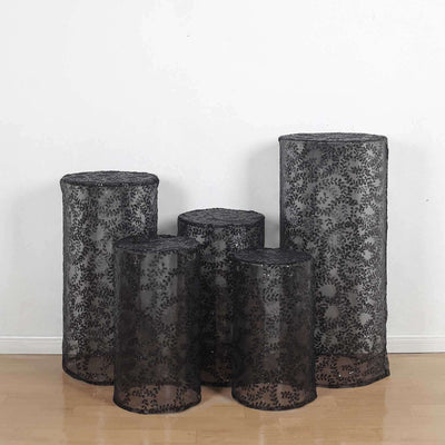 Set of five black lace decorative storage bins in various sizes.