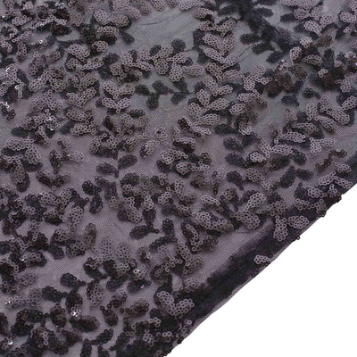 Black sequin floral fabric with intricate detailing and texture.