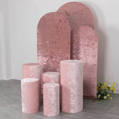 Rose gold velvet display stands in various sizes against a neutral backdrop.