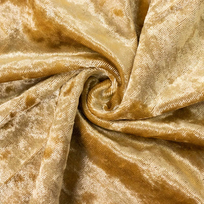 Golden velvet fabric with a soft, textured surface.