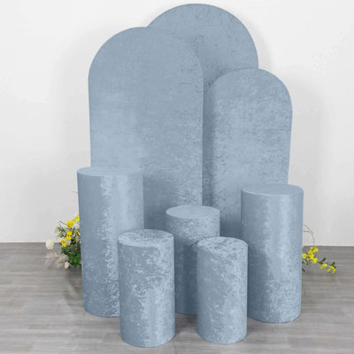 Blue velvet podiums in various shapes and sizes for display purposes.