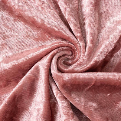 Soft pink velvet fabric swirl texture.