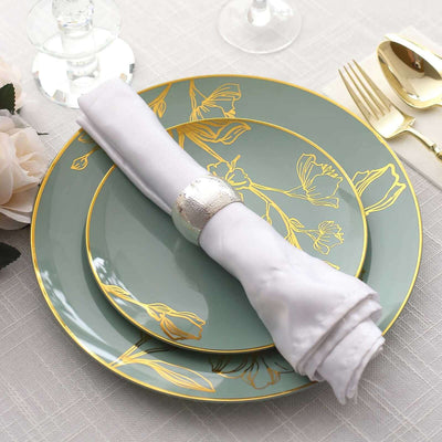 Elegant dinnerware set with decorative plates and napkin holder.