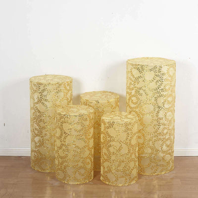 Set of five decorative lace-patterned yellow pedestals