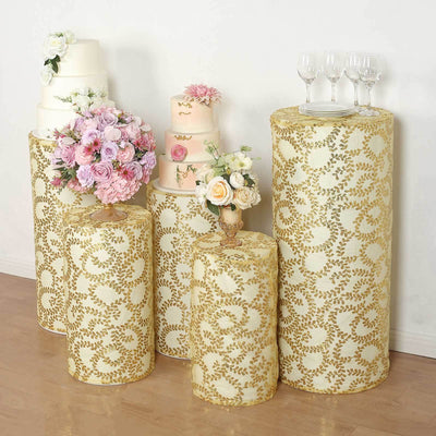 Decorative cake stands with floral arrangements and cakes for events and celebrations.