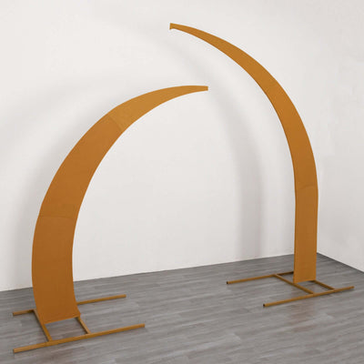 Orange arch display stands on a gray floor against a white wall.