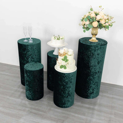 Velvet display pedestals in green for events and decor.