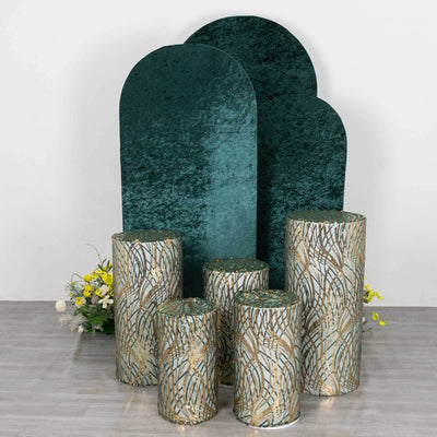 Decorative pedestals and backdrops in green and gold tones for events or displays.