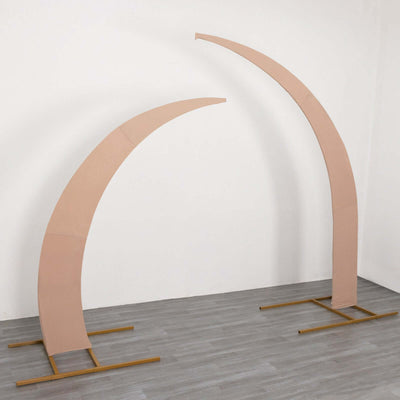 Curved wooden arches on a gold metal base in a minimalist setting.