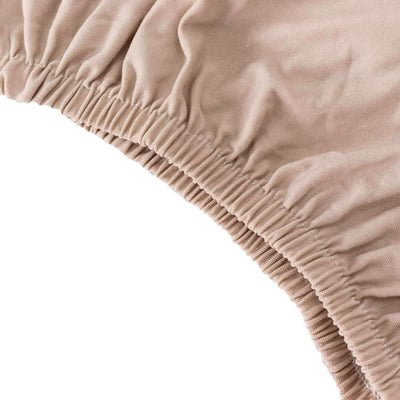 Elastic band detail of a beige fabric product.