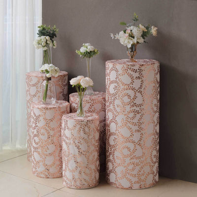Decorative flower vases on patterned pedestals in a stylish interior setting.