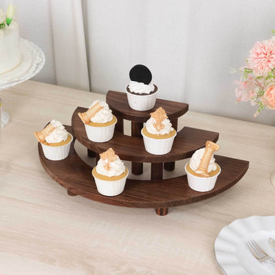 Wooden cupcake stand with assorted cupcakes displayed on tiered levels.