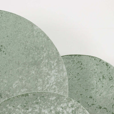 Green textured circular decor pieces on a plain white background.