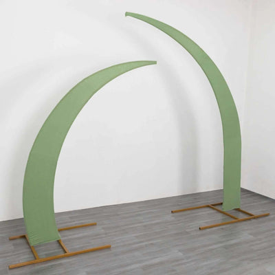 Green curved display stands on a wooden base in a studio setting.