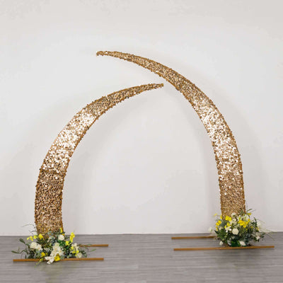 Gold crescent arch with floral arrangements for events and decorations.