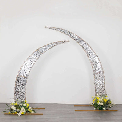 Decorative arch with mirrored accents and floral arrangements