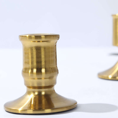 Brass candle holder on a plain background