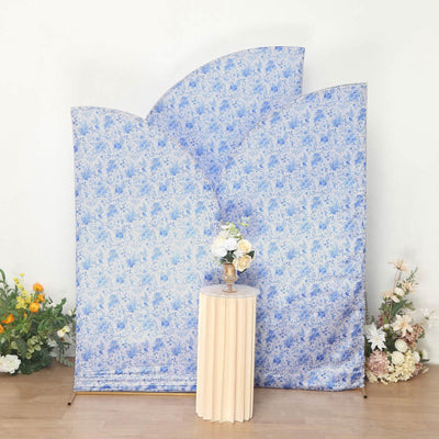 Floral backdrop with blue patterns and a decorative vase on a pedestal table.