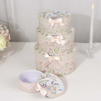 Set of decorative floral gift boxes with ribbons in various sizes.