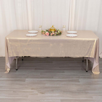 Elegant banquet table setup with floral centerpiece and plates.