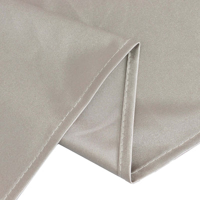 Beige fabric corner with neat stitching and texture detail.