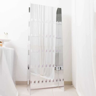 Mirrored display shelf with multiple tiers against a plain backdrop